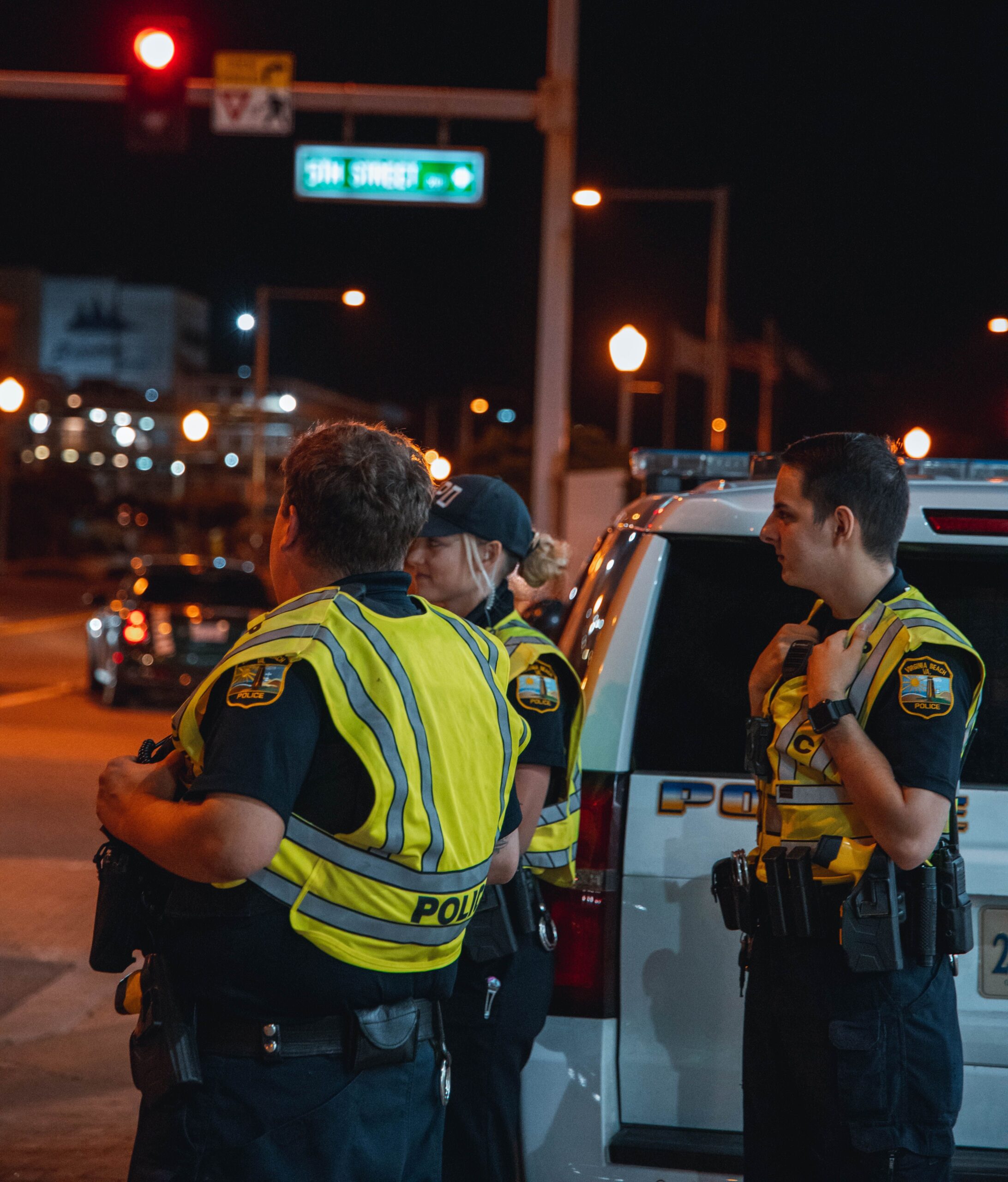 Police officers working at night, representing operational policing and changing performance management requirements
