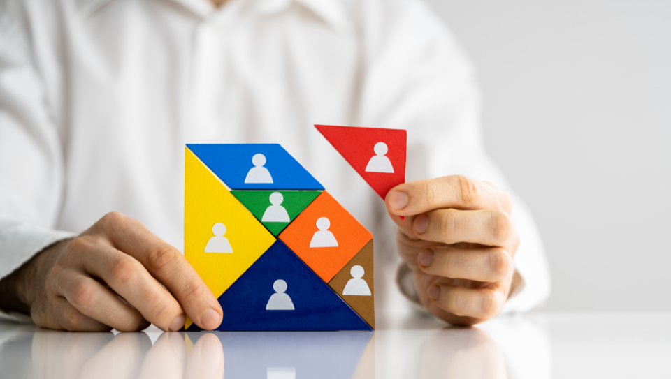 From Pilat to Oracle, And Back Again | Talent Management | Case Study Geometric pieces with people icons being fitted together